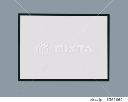 Empty black picture frame on grey background Empty black picture frame on grey background 65656604