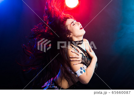 Spirituality dance. Beautiful sexy woman with luxury glossy eastern make-up dancing tribal fusion. Belly dance. Spirituality dance. Beautiful sexy woman with luxury glossy eastern make-up dancing tribal fusion. Belly dance. 65660087