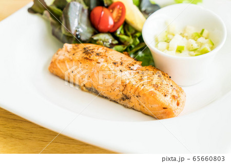 salmon steak with salad 65660803