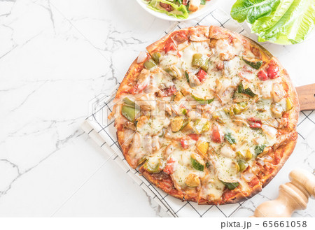 vegetarian pizza on table vegetarian pizza on table 65661058