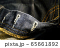 A close up texture background of blue jeans fabric 65661892