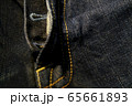 A close up texture background of blue jeans fabric 65661893