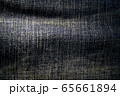 A close up texture background of blue jeans fabric 65661894