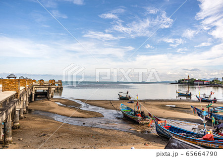 Fishing boats on the shore at low tide . Thailand Fishing boats on the shore at low tide . Thailand 65664790