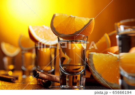 Tequila with orange and cinnamon. Tequila with orange and cinnamon. 65666194
