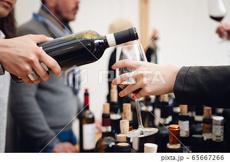 Tasting experience with a female sommelier serving Tasting experience with a female sommelier serving 65667266