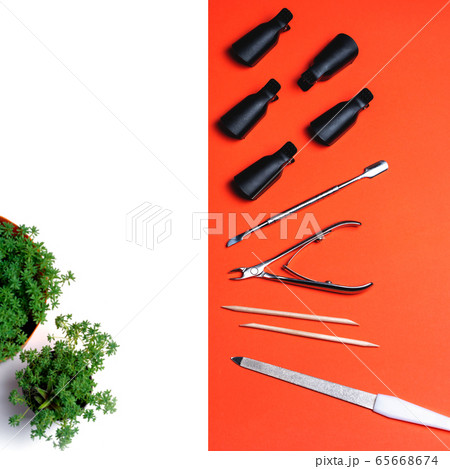 Top view of equipment for manicure and pedicure on a orange background. 65668674