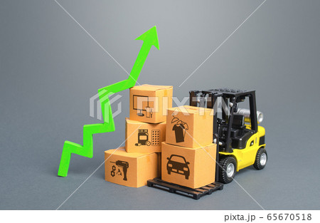 Forklift with boxes and green arrow up. Economic recovery and increased trade and freight traffic. Increasing the cost of transport services tariffs because of special quarantine measures at borders. 65670518
