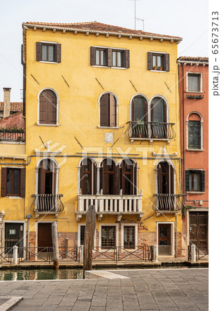 Venice Italy - Old houses and canal of the Venetian lagoon Venice Italy - Old houses and canal of the Venetian lagoon 65673713