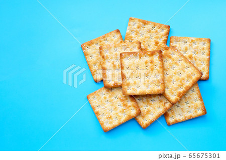 Crackers with sugar on blue background. 65675301