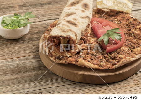 Turkish pizza, made of ground beef and onion Turkish pizza, made of ground beef and onion 65675499