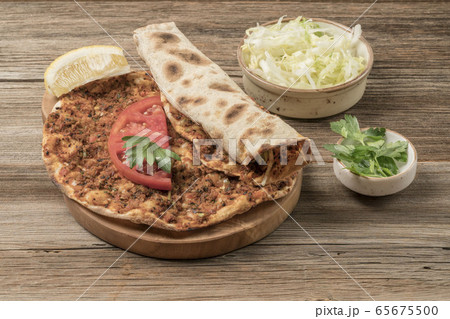 Turkish pizza, made of ground beef and onion Turkish pizza, made of ground beef and onion 65675500