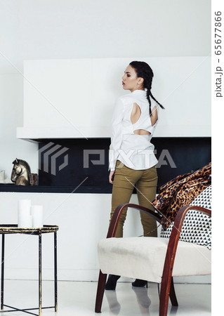 pretty stylish woman in fashion dress with leopard print in luxury house interior, lifestyle people concept 65677866