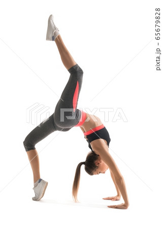 Slim brunette doing fitness profile view 65679828