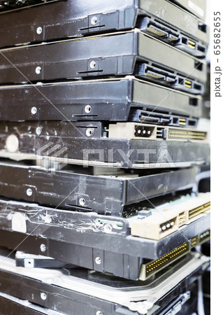 Pile of computer hard disks in recycling plant 65682655