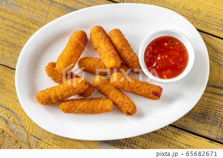 Mozzarella sticks with chili sauce 65682671
