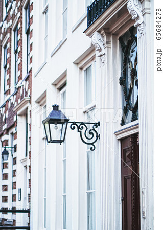 Architectural detail of a building on the main city center street of Amsterdam in Netherlands 65684273