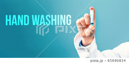 Hand washing theme with a doctor holding a laboratory vial 65690834