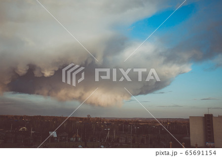 Storm clouds above the ground. Art processing. 65691154