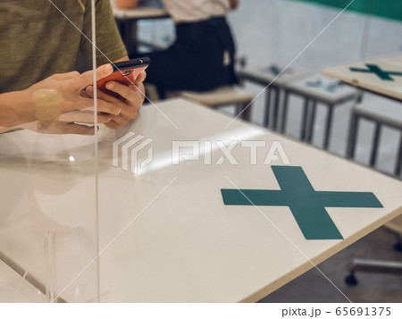 Restaurants in Thailand have measures to prevent the spread of COVID 19 virus by allowing to sit and eat only one table per person 65691375