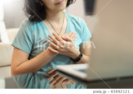 Young woman in blue shirt with sincere smile 65692121