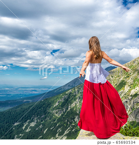Young woman on the top of mountain 65693534