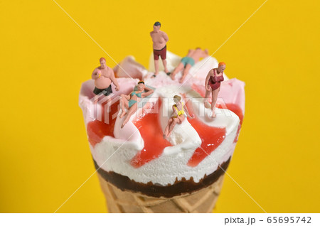 Ice Cream In Waffle Cone and Miniature People Ice Cream In Waffle Cone and Miniature People 65695742