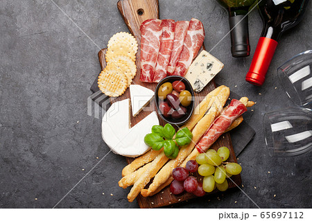 Cheese, meat, grapes and olives antipasto Cheese, meat, grapes and olives antipasto 65697112