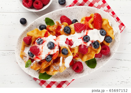 Delicious belgian waffles with summer berries 65697152