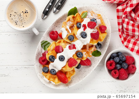 Delicious belgian waffles with summer berries 65697154