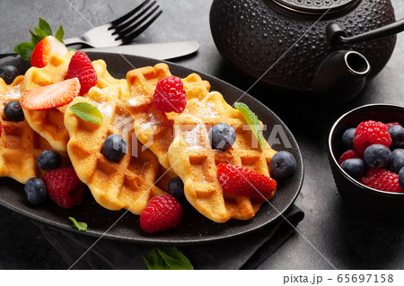 Delicious belgian waffles with summer berries 65697158