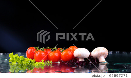 Red tomato cherry, mushrooms and green fresh salad 65697271