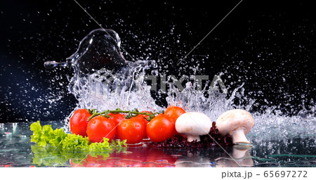 Red tomato cherry, mushrooms and green fresh salad 65697272