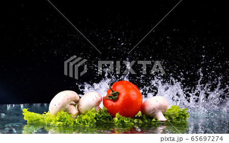 Red tomato cherry, mushrooms and green fresh salad 65697274