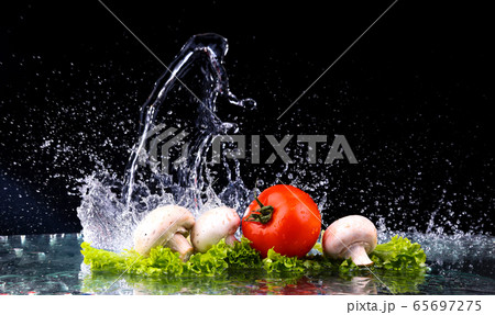 Red tomato cherry, mushrooms and green fresh salad 65697275