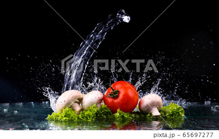 Red tomato cherry, mushrooms and green fresh salad 65697277