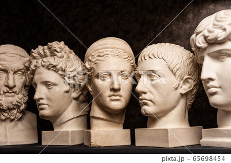 Group gypsum busts of ancient statues human heads for artists on a dark background. Plaster sculptures of antique people faces. Renaissance epoch style. Academic subject. Blank for creativity. Group gypsum busts of ancient statues human heads for artists on a dark background. Plaster sculptures of antique people faces. Renaissance epoch style. Academic subject. Blank for creativity. 65698454
