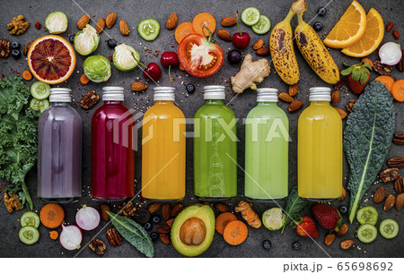 Colourful healthy smoothies and juices. 65698692