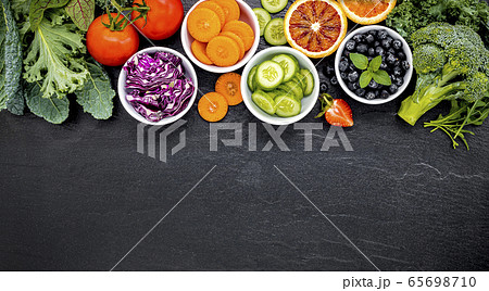 Colourful healthy smoothies and juices in bottles 65698710