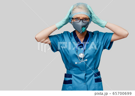 female doctor with stethoscope wearing protective mask and latex gloves over light grey background female doctor with stethoscope wearing protective mask and latex gloves over light grey background 65700699