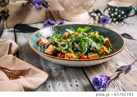 Healthy appetizing tofu salad with vegetables 65702783