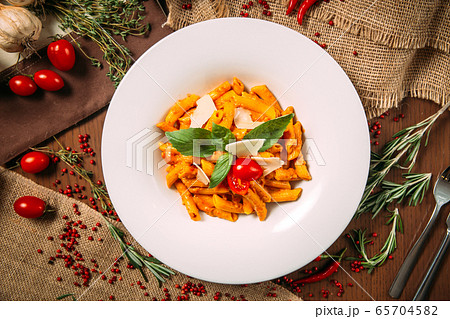 Italian pomadoro penne parmesan cheese and basil Italian pomadoro penne parmesan cheese and basil 65704582