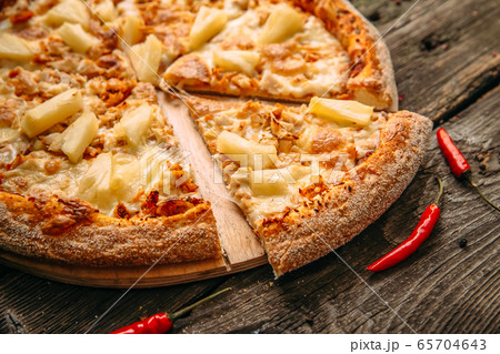 Closeup on appetizing hawaii pizza with pineapple Closeup on appetizing hawaii pizza with pineapple 65704643