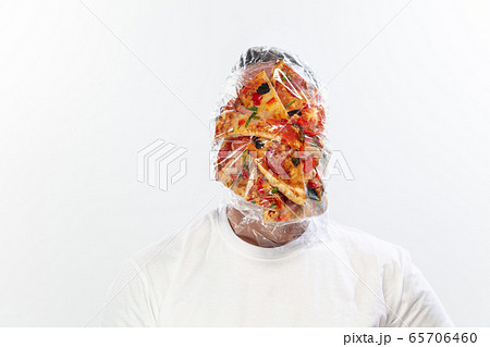 Male face covered with oilcloth, cellophane and unhealthy food, hard to breathe. People lost their faces, can't notice the environmental pollution made by themself. Male face covered with oilcloth, cellophane and unhealthy food, hard to breathe. People lost their faces, can't notice the environmental pollution made by themself. 65706460