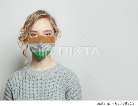 Young woman wearing a face mask with flag.  65709515