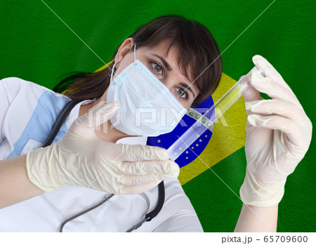 Scientist woman with test tube Coronavirus  65709600