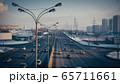 Broadband big highway in the winter. High-voltage towers along the road. 65711661