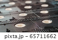 a row of inverted VHS tapes close-up. 65711662