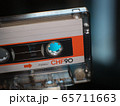 compact white orange cassette closeup. 65711663
