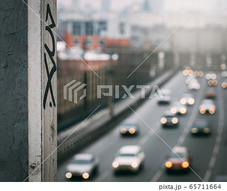 urban graffiti on the background of blurred car traffic in the background urban graffiti on the background of blurred car traffic in the background 65711664